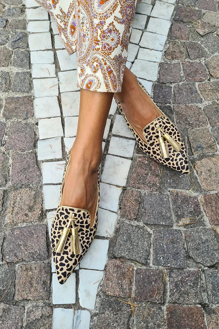 Loafer boots with pom-poms