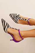 Zebra print décolleté with a purple heel