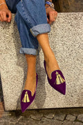 Elegant boot with pom-poms