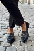 Boot with pom-poms and fringe