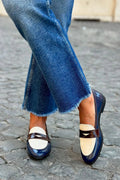 Two-tone loafers with a shiny strap