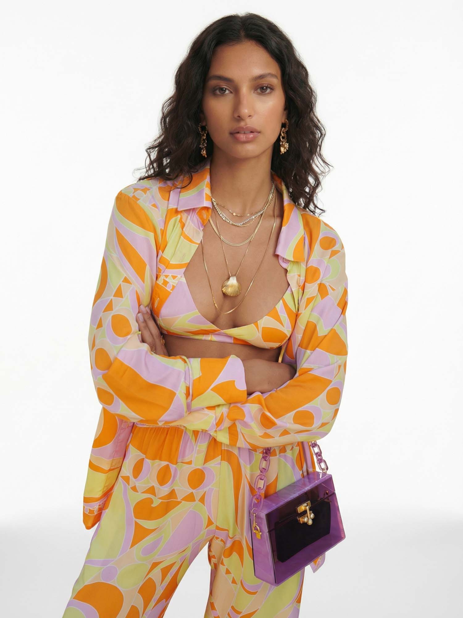 Button-up shirt with a tropical beach graphic print