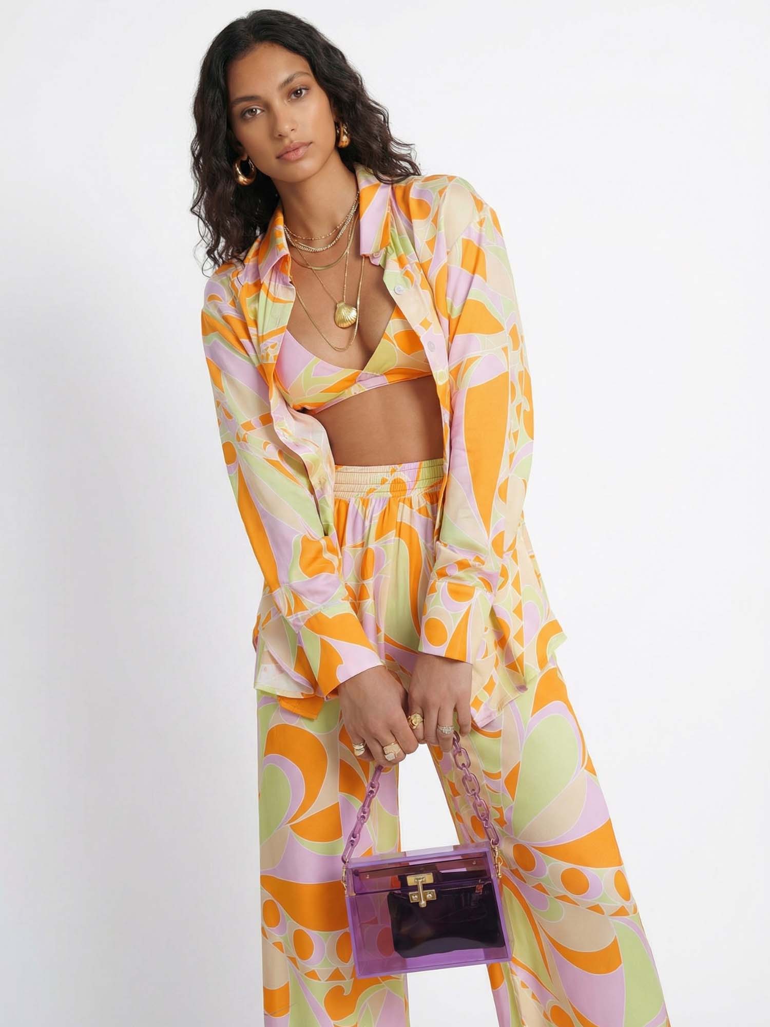 Button-up shirt with a tropical beach graphic print