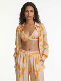 Button-up shirt with a tropical beach graphic print