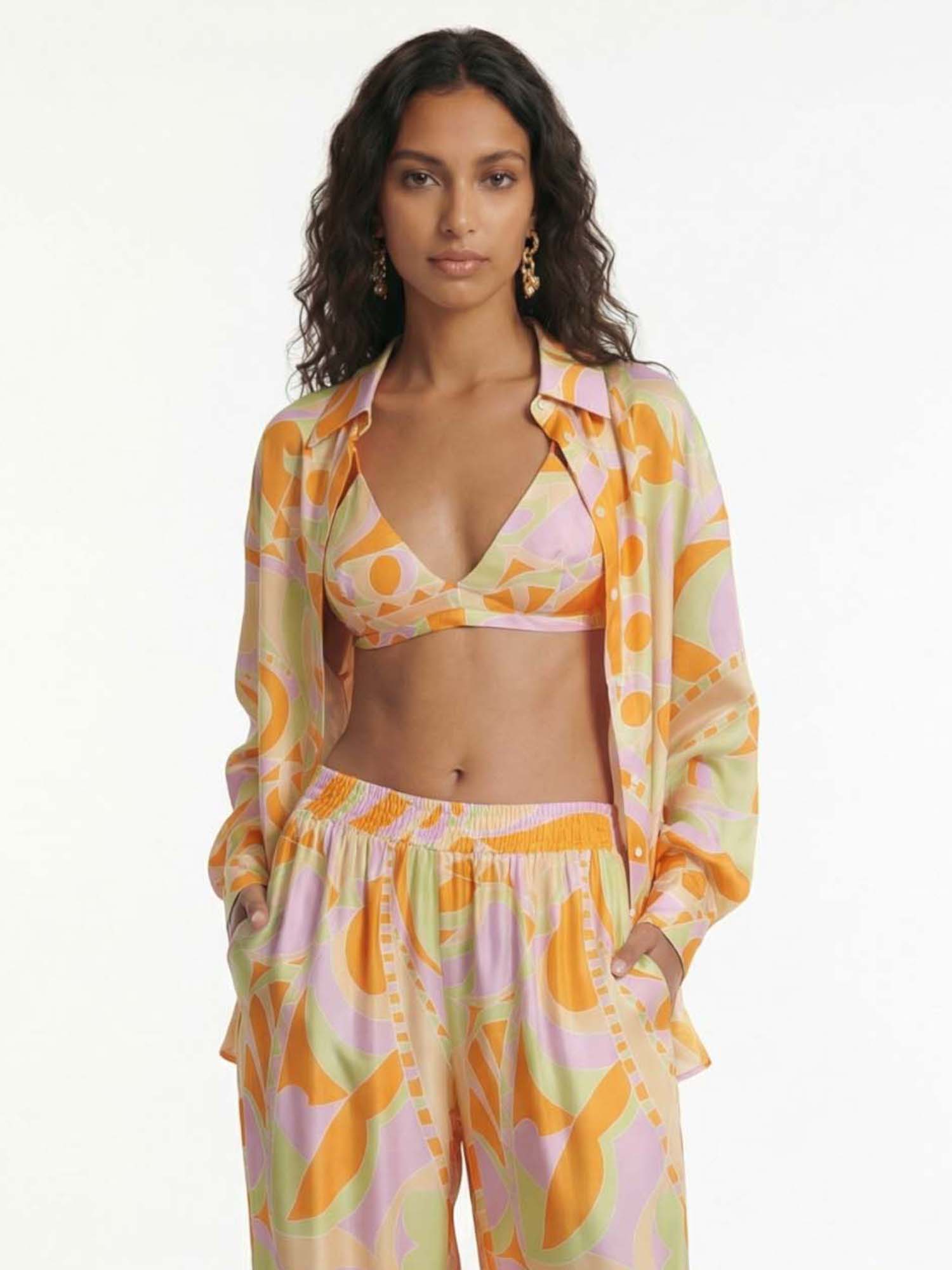 Button-up shirt with a tropical beach graphic print