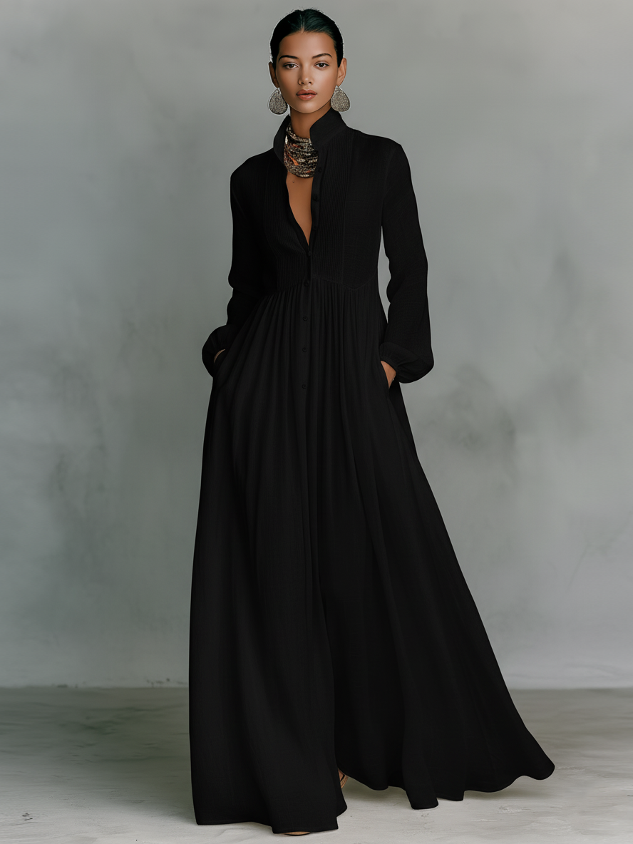 Women's maxi dress in a minimalist style, made of cotton and linen fabric with puzzle pieces, featuring a stand-up collar and long sleeves
