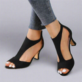 Heeled sandal with a rounded cut-out