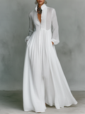 Women's maxi dress in a minimalist style, made of cotton and linen fabric with puzzle pieces, featuring a stand-up collar and long sleeves