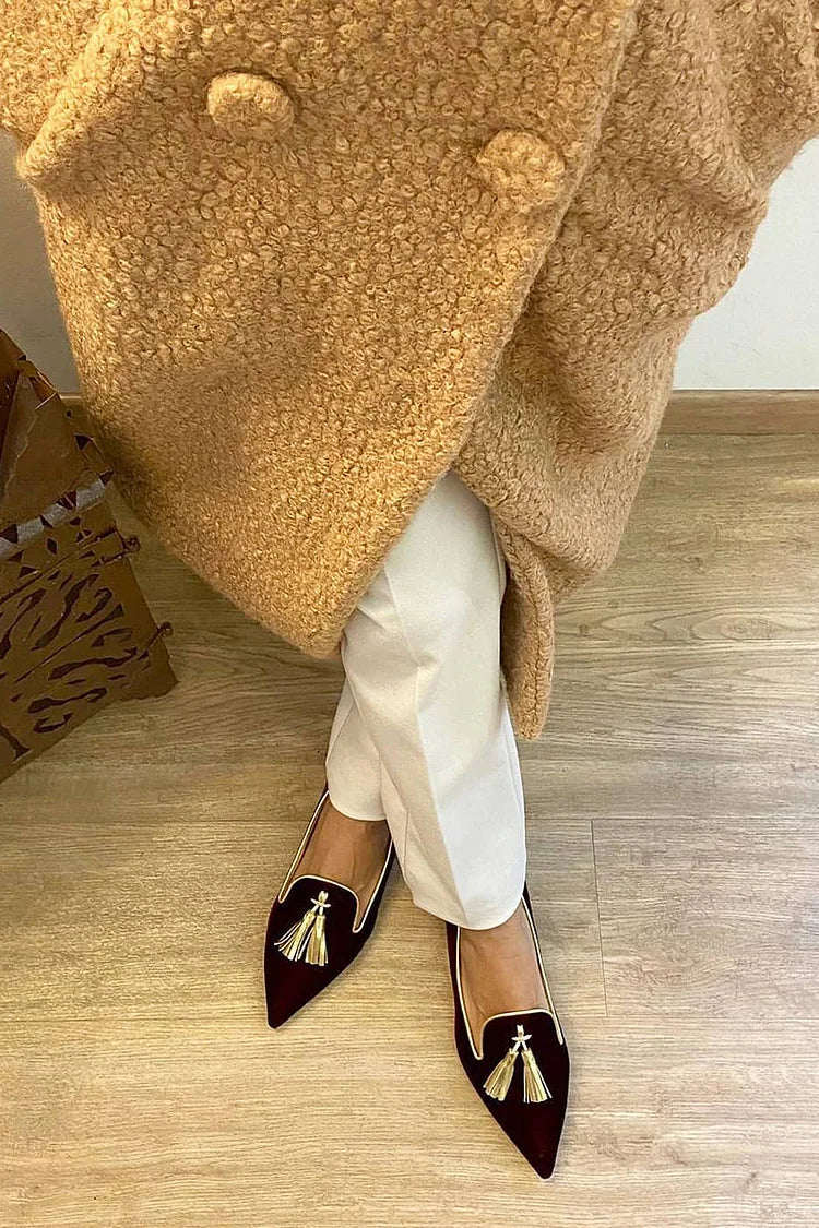 Elegant boot with pom-poms