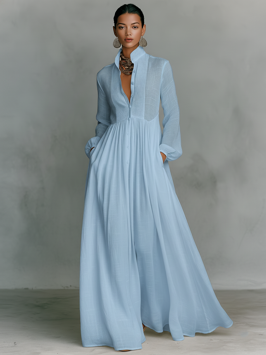 Women's maxi dress in a minimalist style, made of cotton and linen fabric with puzzle pieces, featuring a stand-up collar and long sleeves