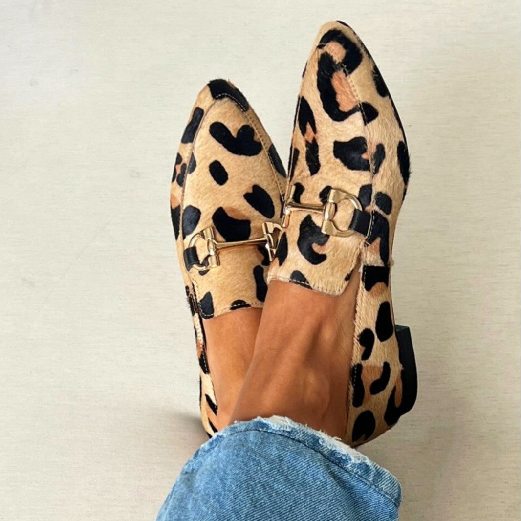 Animal print loafer boots with a decorative clip