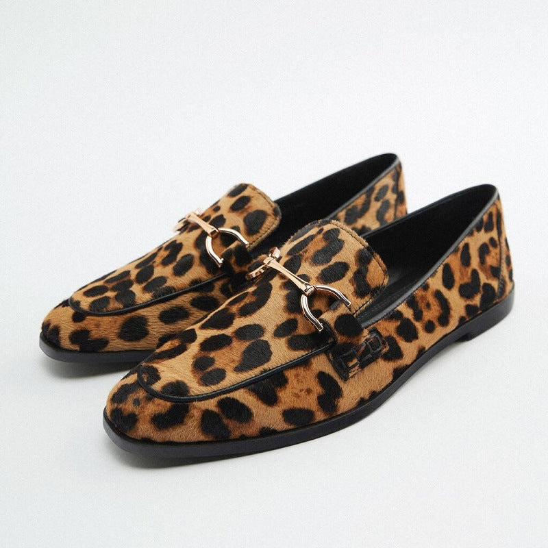 Loafer boots with animal print and metallic detail