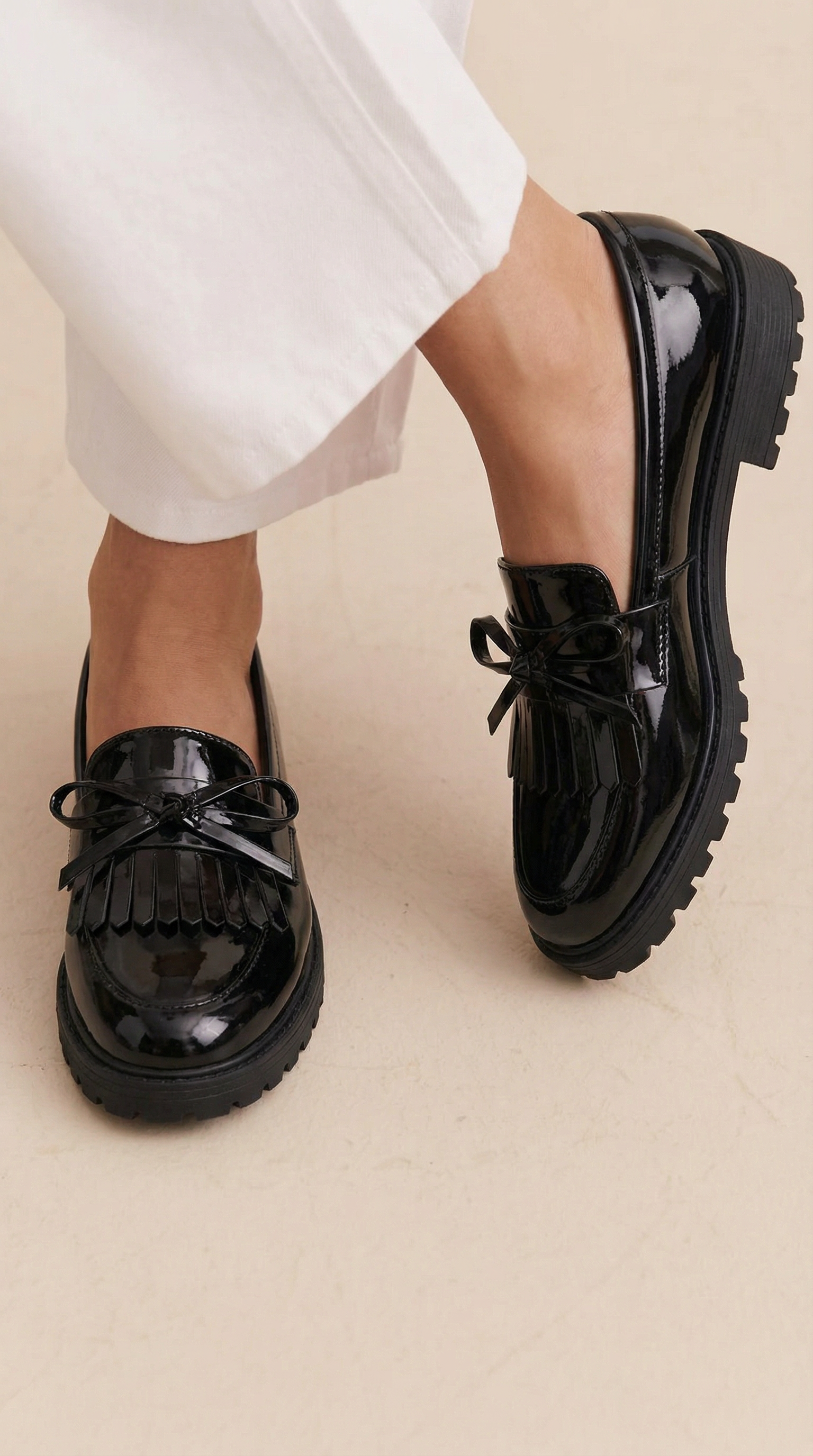 Shiny boot with a pompom