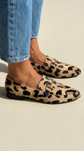 Animal print loafer boots with a decorative clip
